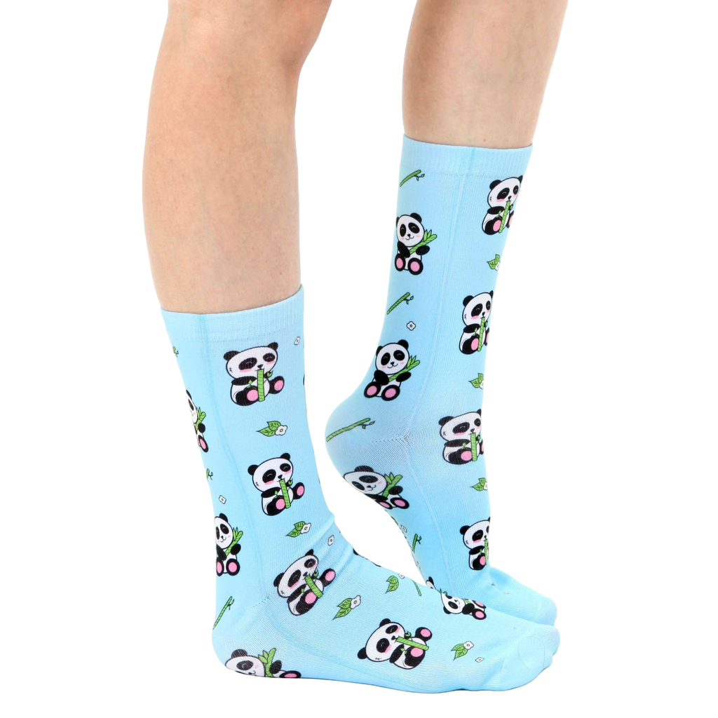 Lifestyle shot of model wearing light blue panda bamboo socks. [lf]