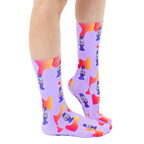 Lifestyle shot showing the socks on a person's feet, showcasing the socks in a casual setting. [lf]