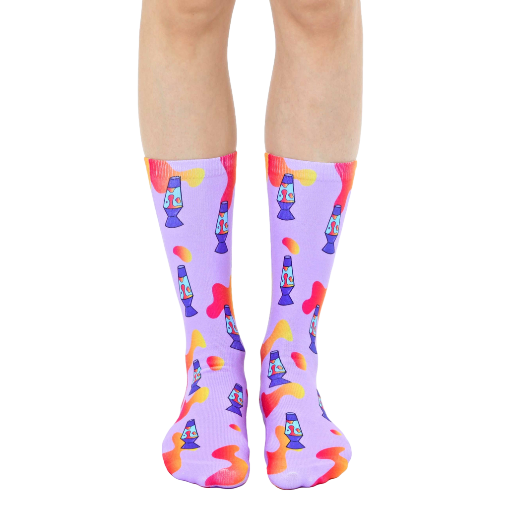 Pair of purple crew socks with a fun lava lamp pattern.  Orange and blue lava lamps are scattered on a light purple background with orange blob accents. [lf]