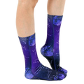 Lifestyle shot of model wearing the Astrology socks, showing the socks from the side and slightly angled. [lf]