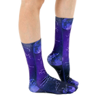 Lifestyle shot of model wearing the Astrology socks, showing the socks from the side and slightly angled. [lf]
