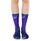 Pair of crew socks in purple and blue gradient.  Design features constellations and moons. [lf]