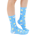 Lifestyle shot of 'Counting Sheep' socks on a person's legs, showcasing the sock's fit and pattern. [lf]