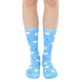 Pair of light blue crew socks with a whimsical design featuring cartoon sheep, moons, and stars. [lf]