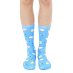 Pair of light blue crew socks with a whimsical design featuring cartoon sheep, moons, and stars. [lf]