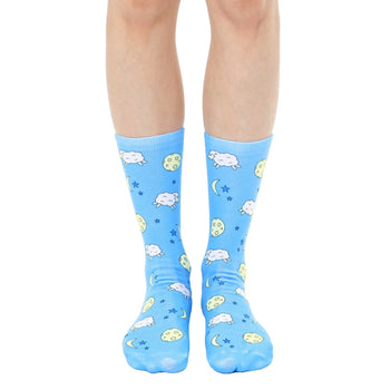 blue crew socks with white sheep, yellow moons, and white stars on them. for women. counting sheep socks  
