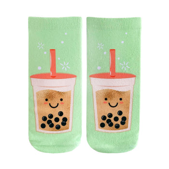 Pair of pastel green crew socks featuring a whimsical illustration of happy boba tea cups with tapioca pearls. 