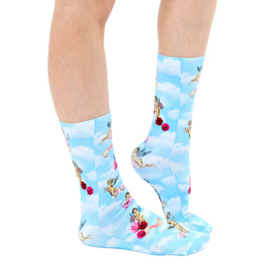 A pair of blue socks with a pattern of clouds, cherubs, and roses. The word 