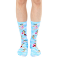 A pair of crew socks on a model's legs. Light blue background with cherubs, roses, and the word 'angel' printed on them. [lf]