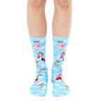 A pair of crew socks on a model's legs. Light blue background with cherubs, roses, and the word 'angel' printed on them. [lf]