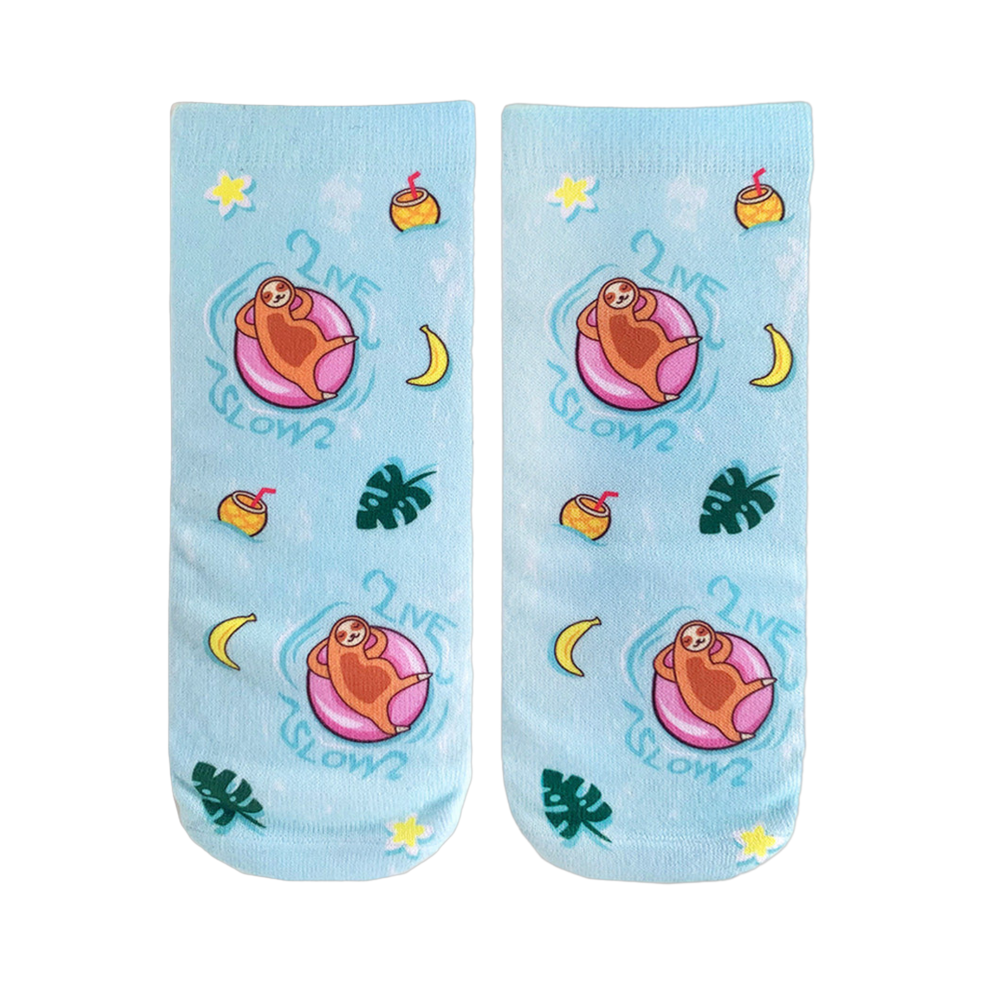 Pair of light blue crew socks.  Design features sloths on pink floaties, tropical fruits, plants, and the text 'Live Slow'.
