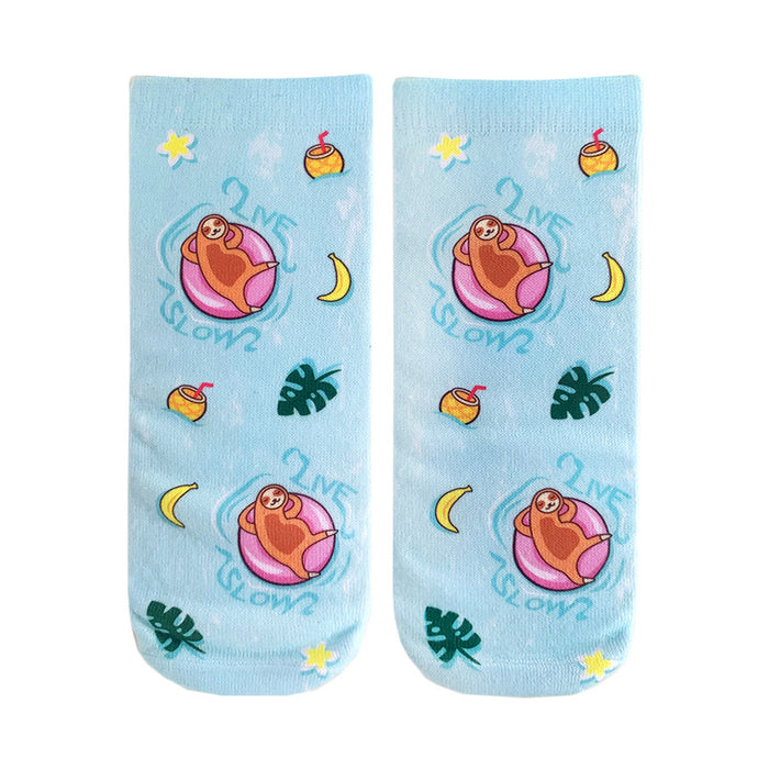 blue ankle socks for women featuring a pattern of sloths floating on inner tubes with sunglasses, bananas, palm leaves, and coconut drinks.   }}