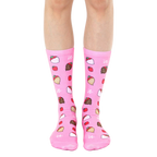 A pair of pink crew socks with a whimsical pattern of chocolate-covered strawberries. [lf]