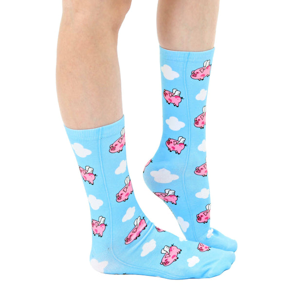 Lifestyle shot showcasing 'Pigs Fly' socks on a model's legs.  Shows the sock fit and pattern. [lf]