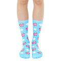 Crew socks in pastel blue featuring a whimsical pattern of pink pigs with wings flying among white clouds. [lf]