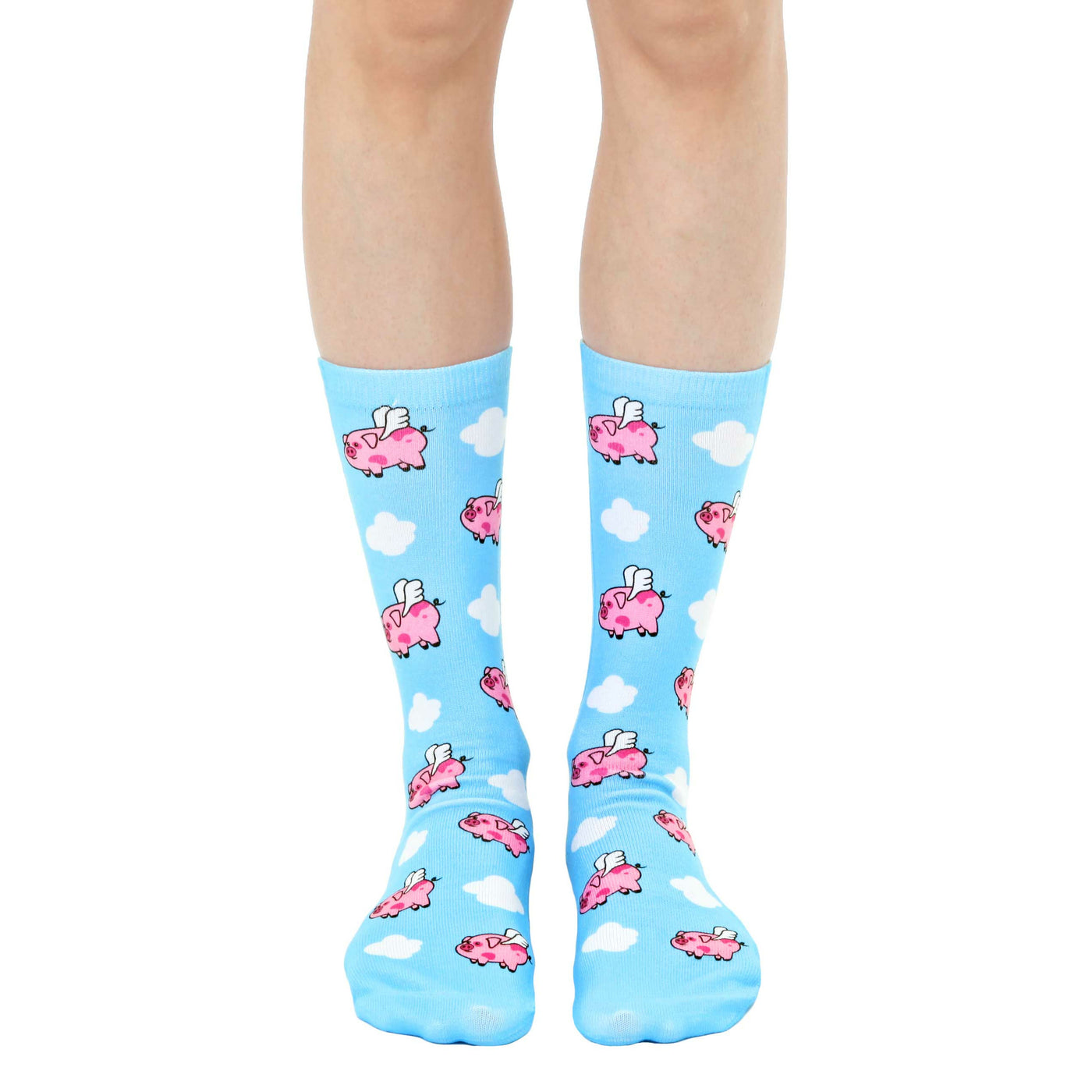 Crew socks in pastel blue featuring a whimsical pattern of pink pigs with wings flying among white clouds. [lf]