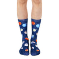 Crew socks showcasing a navy blue background with colorful planets, stars, and planet names. Fun, space-themed socks. [lf]