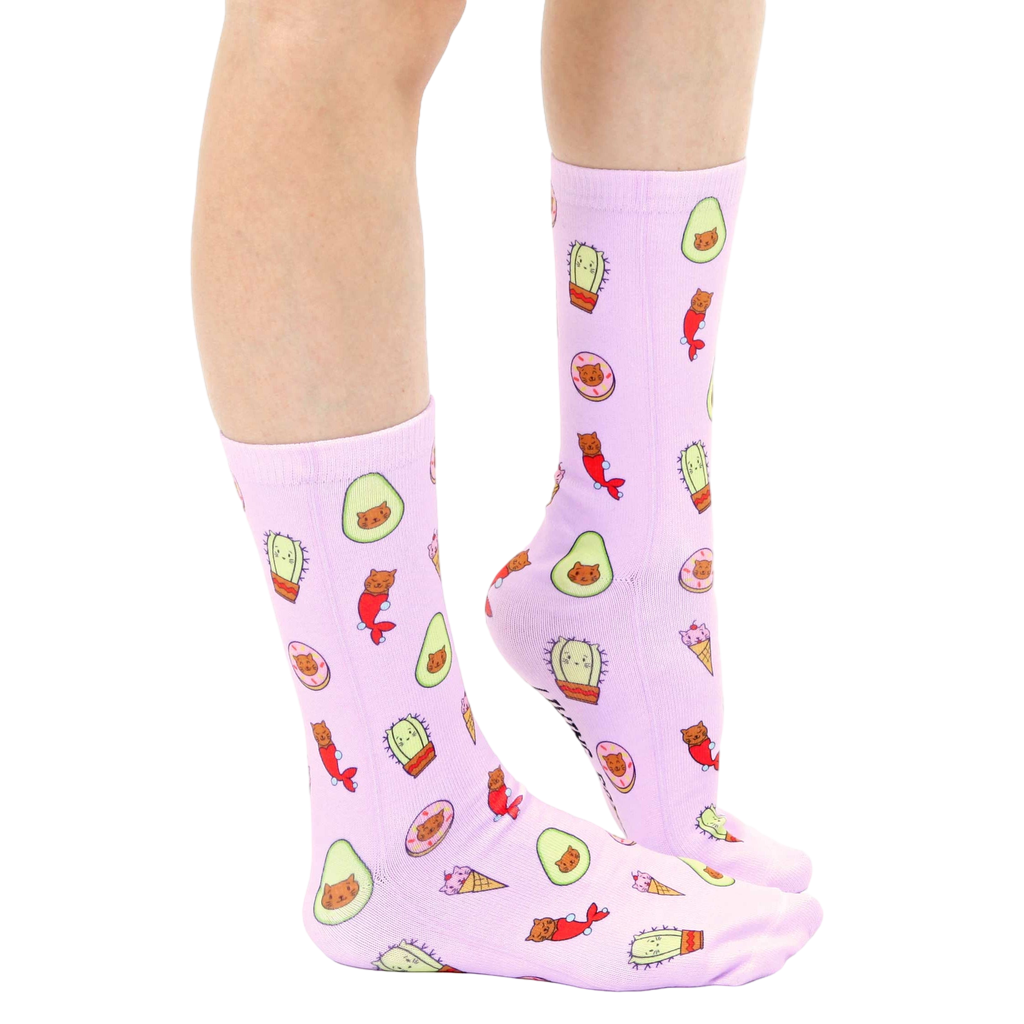 Lifestyle shot showing the 'Cats As Things' socks on a person's legs from the knees down. [lf]
