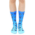 Pair of crew socks in blue ombre, featuring a Magic 8 ball design with phrases like 'Outlook Good' and 'Try Again'. [lf]