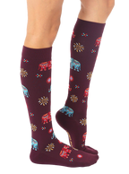 Lifestyle shot showing the Elephant knee-high socks on a model's legs. [lf]