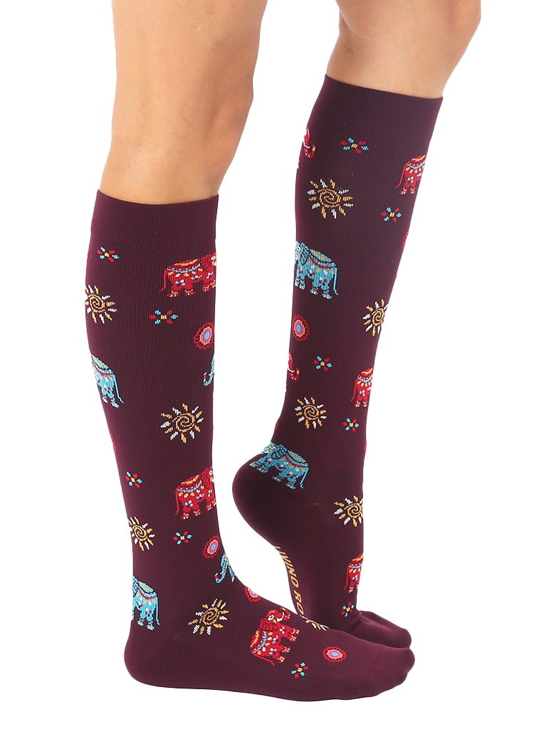 Lifestyle shot showing the Elephant knee-high socks on a model's legs. [lf]