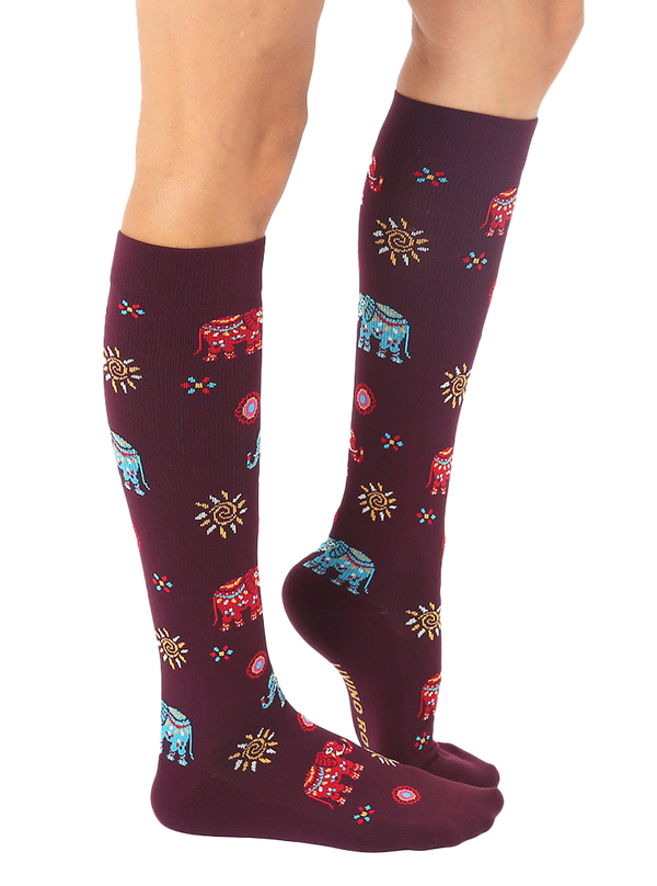 Lifestyle shot showing the Elephant knee-high socks on a model's legs. [lf]