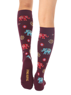 Close-up showcasing the back of the burgundy Elephant knee-high socks, with the 'Living Royal' logo visible. [lf]