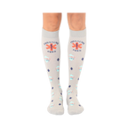 Pair of grey crew socks with a repeating pattern of medical crosses, 'Frontline Hero', and 'Saving Lives' in orange and teal.