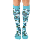Pair of teal knee-high socks with a green, white, and blue camouflage pattern.  The socks have a teal cuff. [lf]