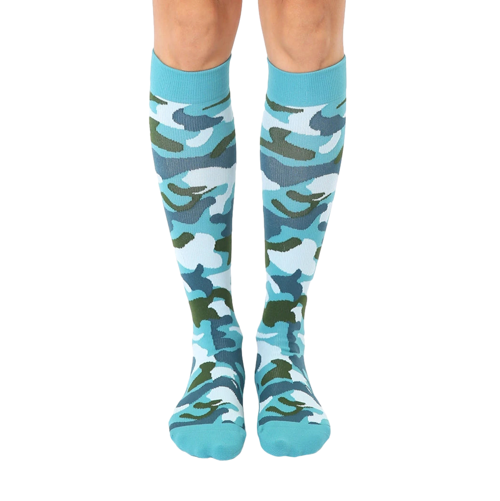 Pair of teal knee-high socks with a green, white, and blue camouflage pattern.  The socks have a teal cuff. [lf]