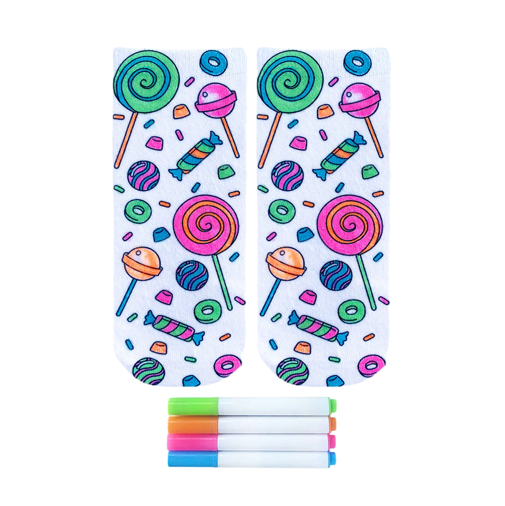 Pair of ankle socks featuring a candy-themed design in bright pink, green, blue, and orange.  Lollipops, gummies, and other sweets are scattered on a white background. Includes four fabric markers. [lf]