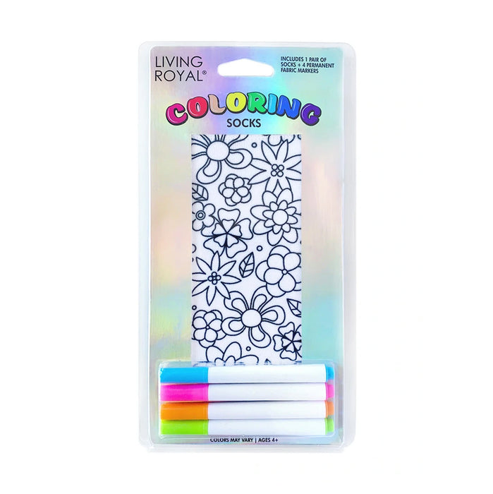 A package of white socks with a floral pattern printed in black ink. The socks are packaged with four permanent fabric markers in the colors blue, green, pink, and yellow. The package has a cardboard backing with a clear plastic front.