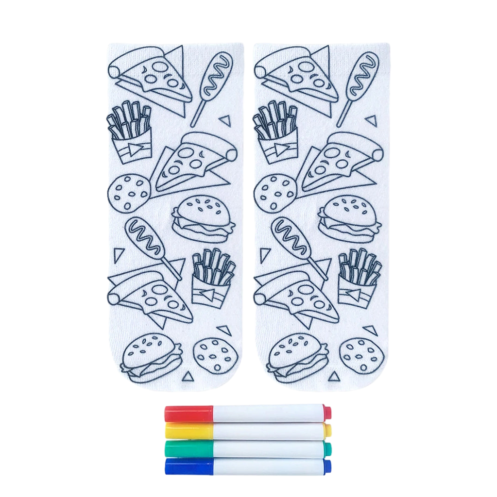 Pair of white crew socks featuring outline drawings of junk food like pizza, burgers, and fries.  Includes four fabric markers for coloring. [lf]