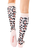 Back view of the leopard print knee-high socks, showcasing the 'Living Royal' logo on the heel. [lf]