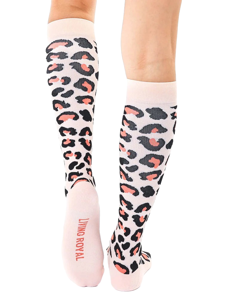 Back view of the leopard print knee-high socks, showcasing the 'Living Royal' logo on the heel. [lf]