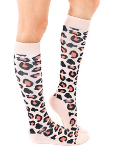 A pair of pink knee-high socks with a black and coral animal print.