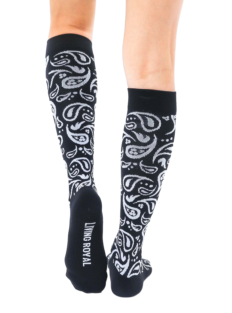 Back view of the black and silver paisley knee-high socks, showcasing the 'Living Royal' logo on the heel. [lf]