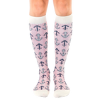 Pair of women's knee-high socks in white with a red and navy anchor and herringbone pattern. [lf]