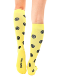 Close-up of the back of the yellow smiley face knee-high socks, showcasing the 'Living Royal' logo. [lf]
