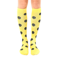 Pair of yellow knee-high socks with a repeating black smiley face pattern.  Fun and comfortable! [lf]