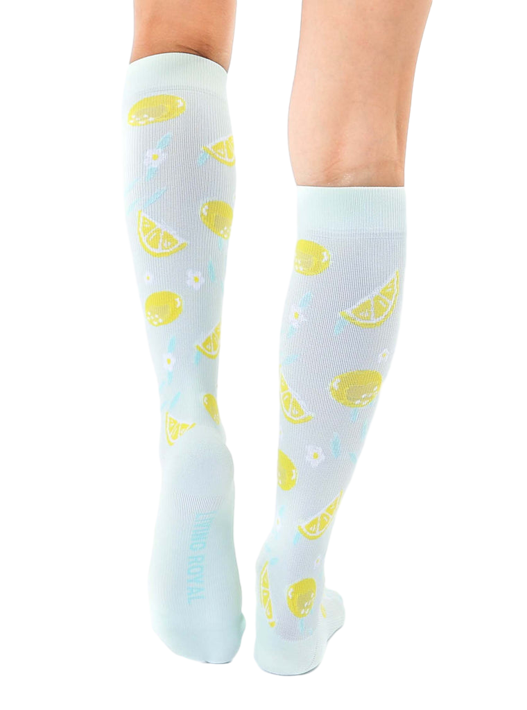 Back view of the lemon knee-high socks, showcasing the full pattern on both socks. [lf]