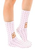 Lifestyle shot of a person's legs wearing the 'Peace Love' socks. Socks are shown from the side, highlighting their full length. [lf]