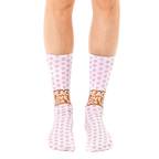 A pair of women's crew socks in light pink.  Tiny hearts cover the socks, with a 'Peace Love Fuck You' message near the ankle in a light brown color. [lf]