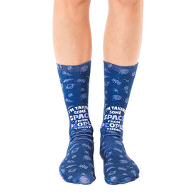 blue crew socks with celestial pattern and the phrase "i'm taking space from people today". fun, sassy socks for men and women who love space.  