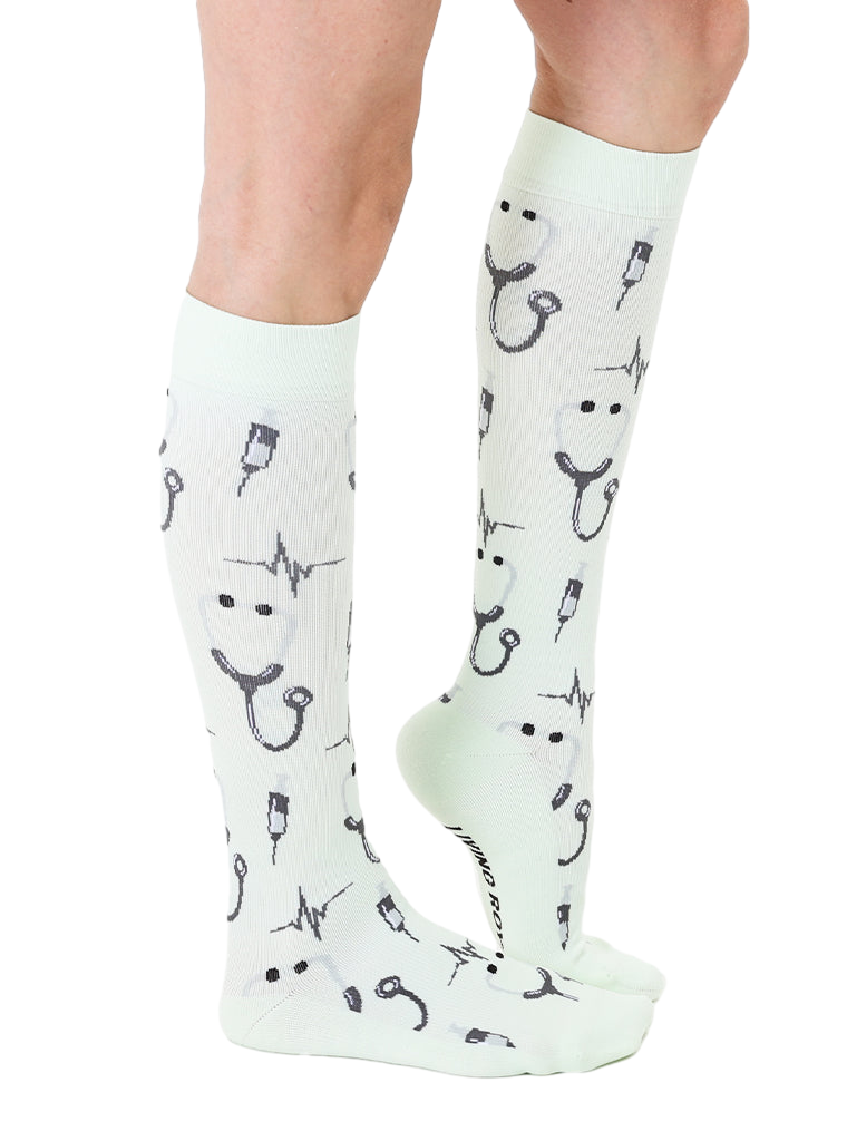Lifestyle shot of a person wearing a mint green Pulse sock. Shows the sock's length and design on the leg. [lf]