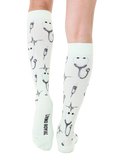 Back view of mint green Pulse socks. Shows the design and the Living Royal logo on the heel. [lf]