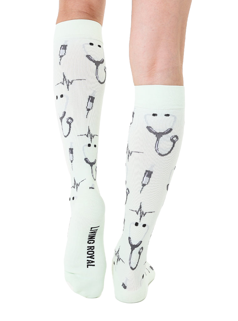 Back view of mint green Pulse socks. Shows the design and the Living Royal logo on the heel. [lf]