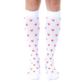 Pair of white knee-high socks with a repeating pattern of small red hearts. [lf]