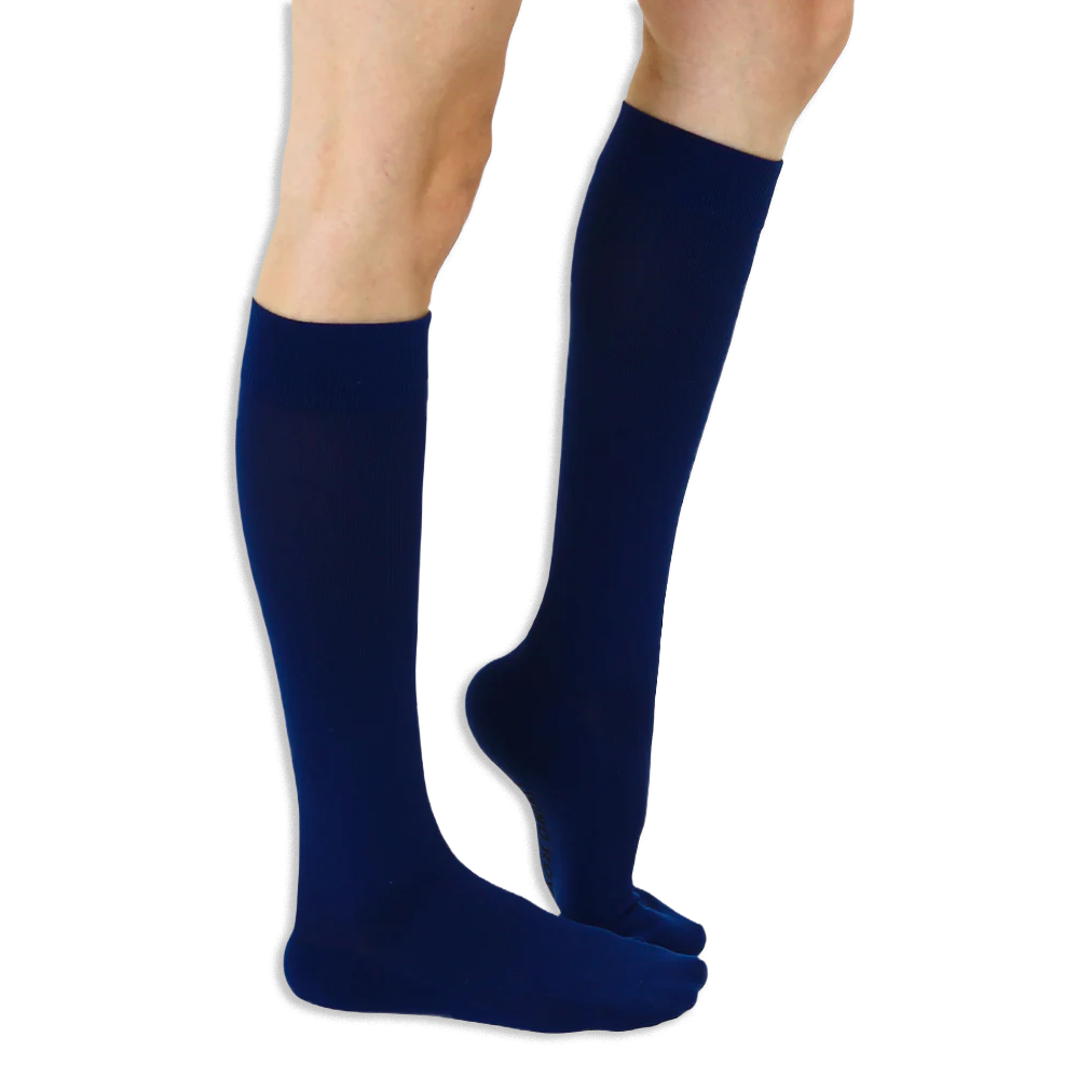 Close-up detail showing the smooth top cuff and soft knit fabric of the solid knee-high socks.