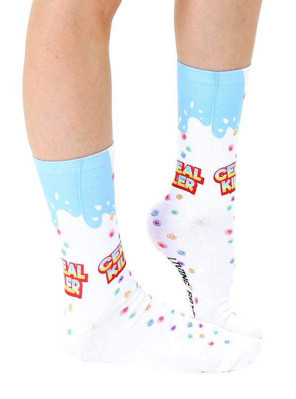 Lifestyle shot of a person's legs wearing the Cereal Killer socks.  Shows the socks on a foot and lower leg. [lf]